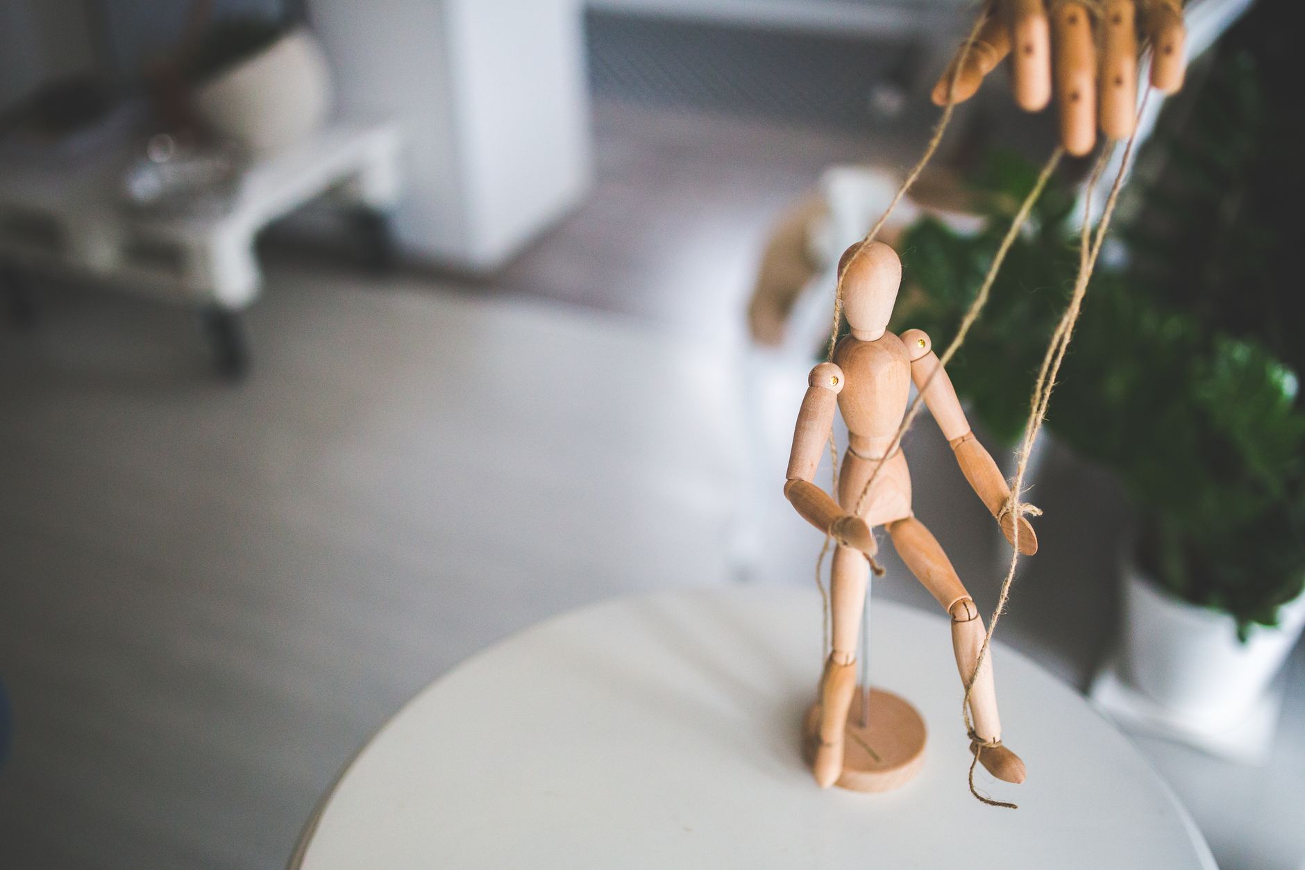 wooden mannequin as a marionette